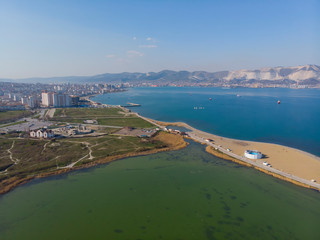 Obraz premium picturesque landscape, shooting from a bird's aerial view of Novorossiysk, mountains, spit.