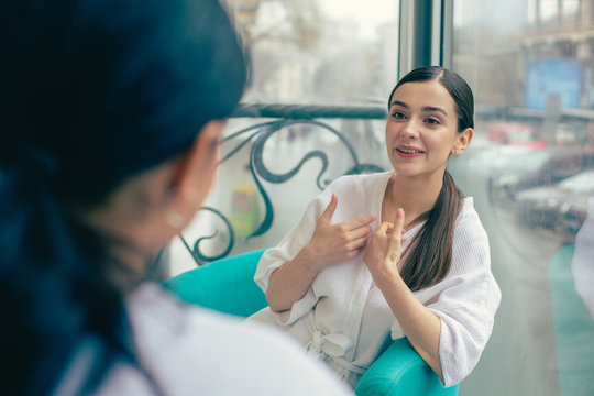 Emotional Woman Pointing To Herself While Talking