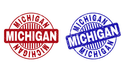 Grunge MICHIGAN round stamp seals isolated on a white background. Round seals with grunge texture in red and blue colors. Vector rubber imitation of MICHIGAN title inside circle form with stripes.