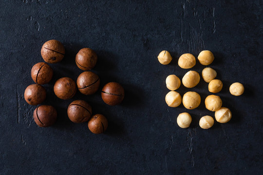 Top view of background texture of fresh natural unshelled raw macadamia nuts, full frame and flat lay