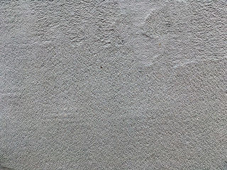 Uneven putty texture. Rough and grungy background of putty