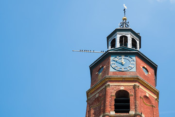 tower of Sint-Lambertuskerk, Buren, The Netherlands. Blue sky, copy space