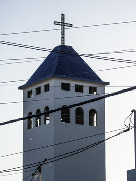 Chuch tower behind wires
