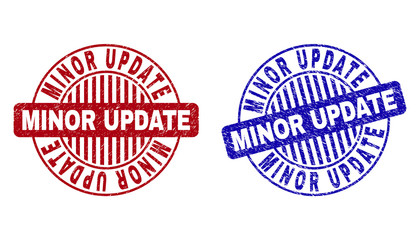 Grunge MINOR UPDATE round stamp seals isolated on a white background. Round seals with grunge texture in red and blue colors.