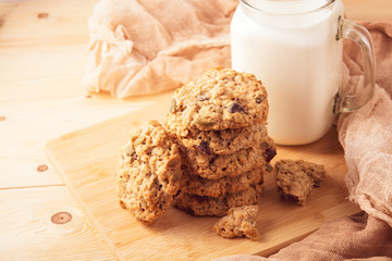 cookies and milk on wooden table