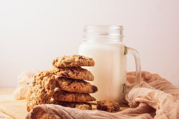 cookies with milk on wooden background