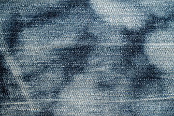Close up of  blue denim jeans fabric texture background.