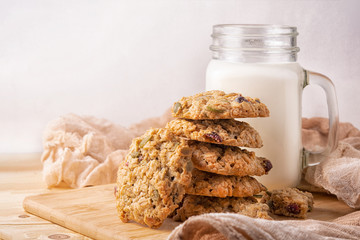 cookies and milk on wooden background