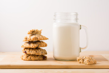 cookies and milk on wooden table