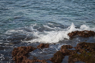 waves crashing on rocks