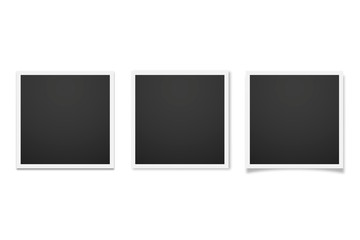 Realistic empty photo frames on white background with different shadows.