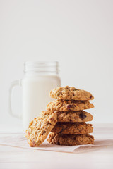 Fototapeta na wymiar oatmeal cookies with milk on a light background