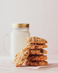 oatmeal cookies with milk on a white background