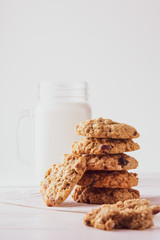 oatmeal cookies with milk on a white background