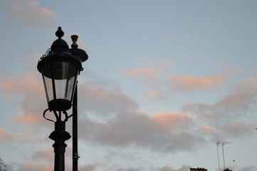 old street lamp on background of blue sky