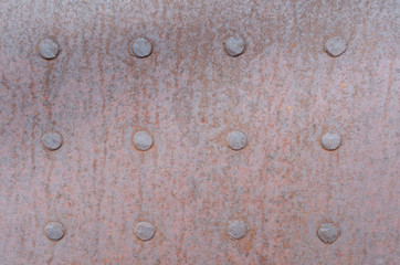 Rusty Metal Sheet with Twelve Rivets