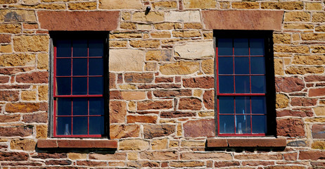 Old windows in stone wall
