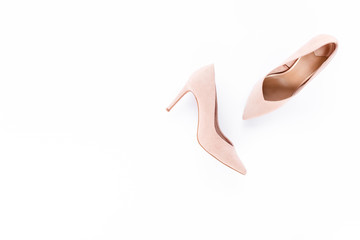 Pastel pink women high heel shoes on pink background. Flat lay, top view trendy fashion feminine...