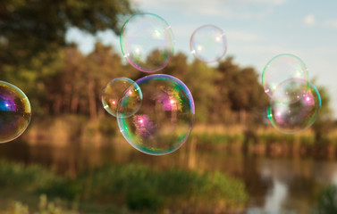 soap bubbles into the sunset with beautiful bokeh.close-up