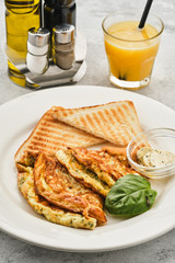 Omelet with herbs, bread and butter. Healthy breakfast