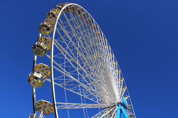 Ferris wheel against blue sky
