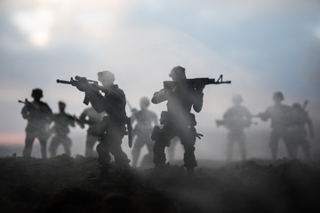 War Concept. Military silhouettes fighting scene on war fog sky background, World War Soldiers...