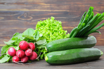 Spring vegetables on wooden background