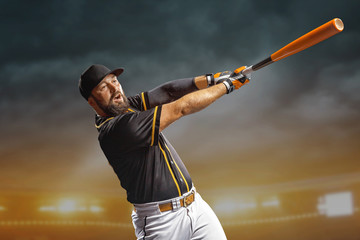 Professional baseball player in action on grand arena in evening during a game.