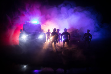 Police cars at night. Police car chasing a car at night with fog background. 911 Emergency response pSelective focus