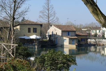 Fototapeta na wymiar panorama of Medieval village of Borghetto on Mincio river from the riverside