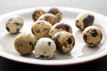 Quail Eggs on the gray plate, eco product
