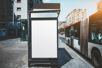 An empty poster mock-up on an outer side of the bus stop; advertising billboard placeholder...