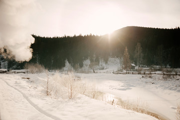 Fantastic evening winter landscape. Dramatic overcast sky. Creative collage. Beauty world.