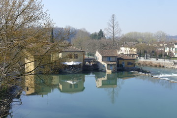 Fototapeta na wymiar panorama of Medieval village of Borghetto on Mincio river from the Roman bridge