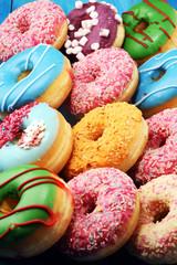 Fototapeta na wymiar donuts in different glazes with chocolate