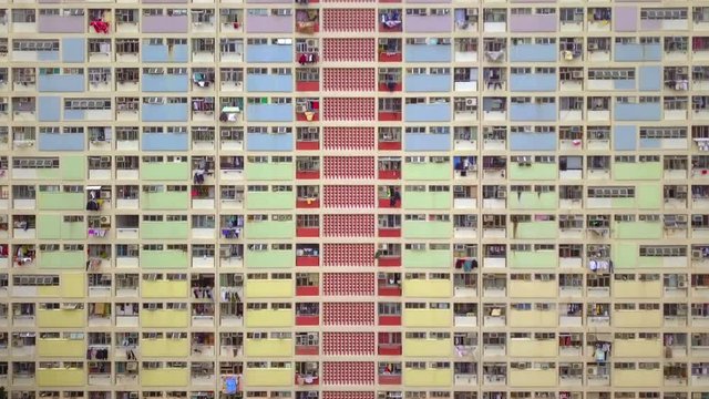 Colorful rainbow pastel building with basketball court and facade windows background. Architecture building design in Choi Hung Estate, Kowloon, Hong Kong City, China.