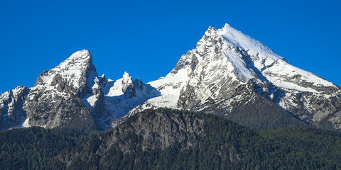 Fototapeta na wymiar Spring snow-capped peaks of Watzmann mountain in national park Berchtesgaden