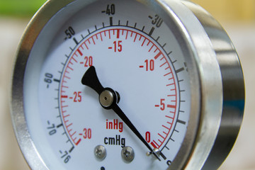 Vacuum pressure gauge meter in a close-up picture