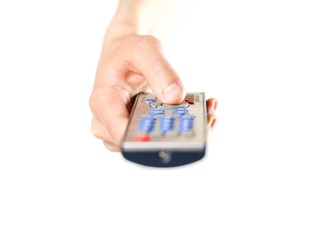 Hand holding the TV remote. Close up. Isolated on white background