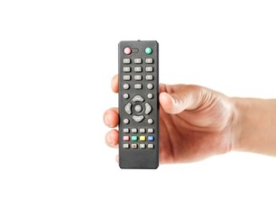Hand holding the TV remote. Close up. Isolated on white background