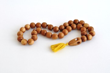 Rosary made of wood light brown.
