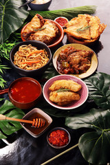 Assorted Chinese food set. Chinese noodles, fried rice, peking duck, dim sum, spring rolls. Famous Chinese cuisine dishes on table. Chinese restaurant concept. 