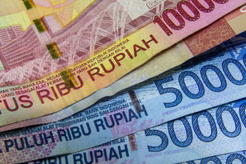 Mixed Indonesian banknotes in a close-up picture