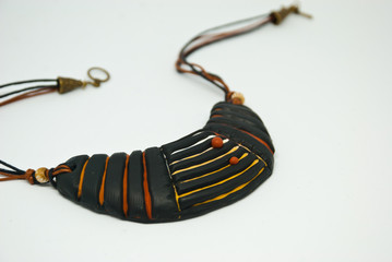 Isolated handmade ethnic bib necklace polymer clay. Black tribal jewelry.