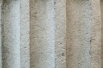 Element of solid stone architectural column closeup as stone background