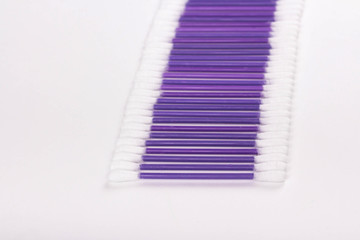 purple cotton buds on a white background