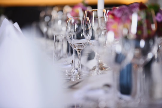 wine glasses on the decorated table in the restaurant