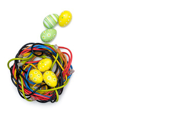 Easter eggs and nest of internet cables on white backgound