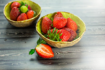 Strawberries on wooden background. Fresh vitamin organic berries