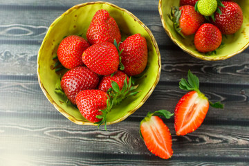 Strawberries on wooden background. Fresh vitamin organic berries